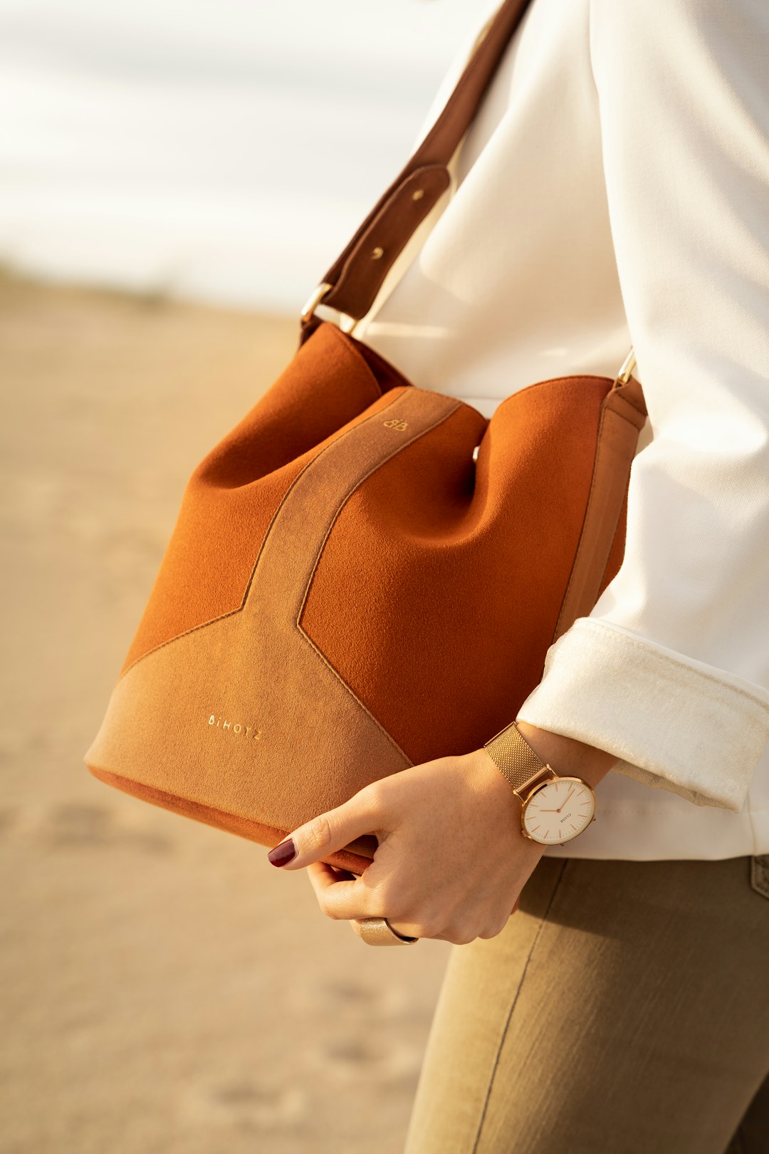 Vegan eco-friendly leather handbag — sustainable handbag manufacturing example with natural camel tones