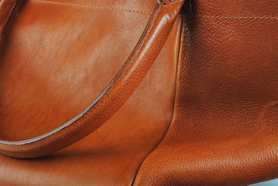 Brown genuine leather crossbody handbag showing material quality and craftsmanship