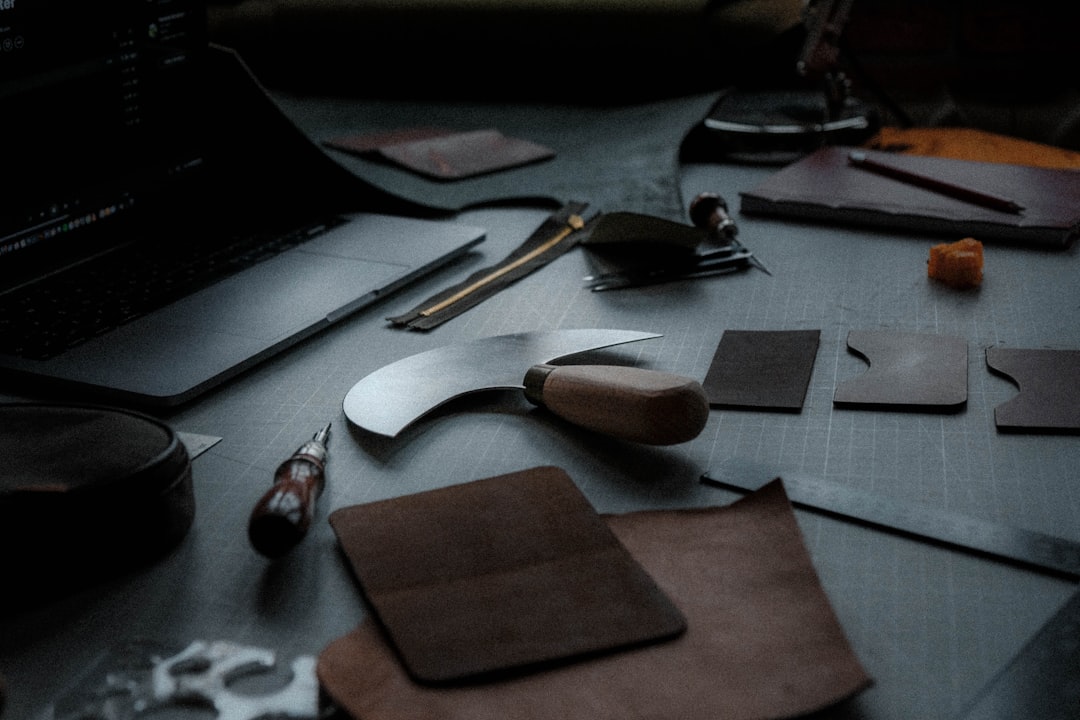 Leather artisan workbench — handbag quality control and inspection process in OEM factory